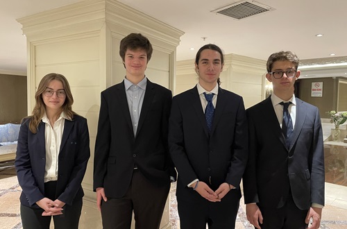 Four Athens College students in the 2023 National Debate Team